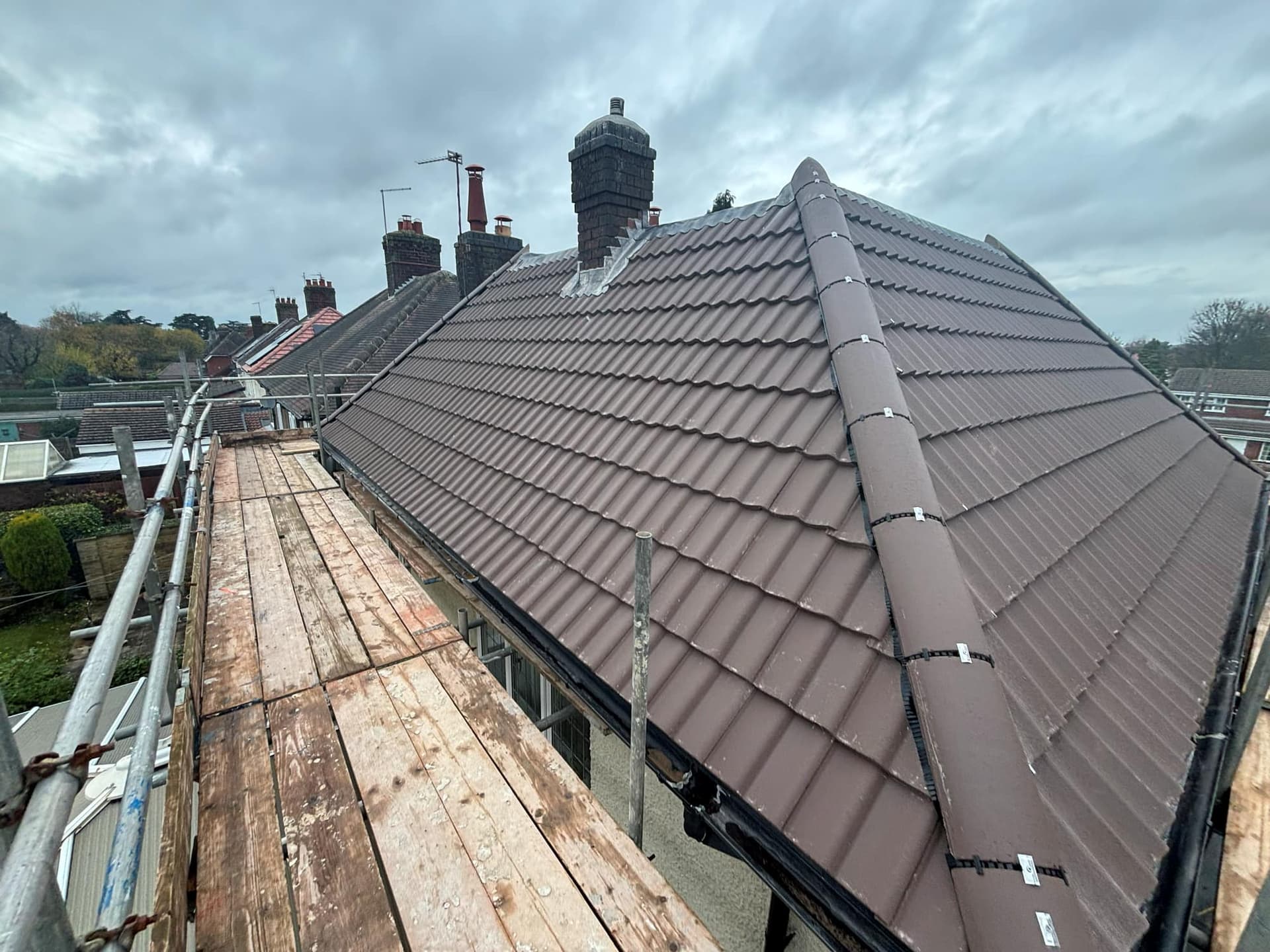 New Roof Installation in Greenhill Coalville Using a Sandtoft Double Pantile — roofing work by Armour Shield Roofing Services Coalville (photo 1)