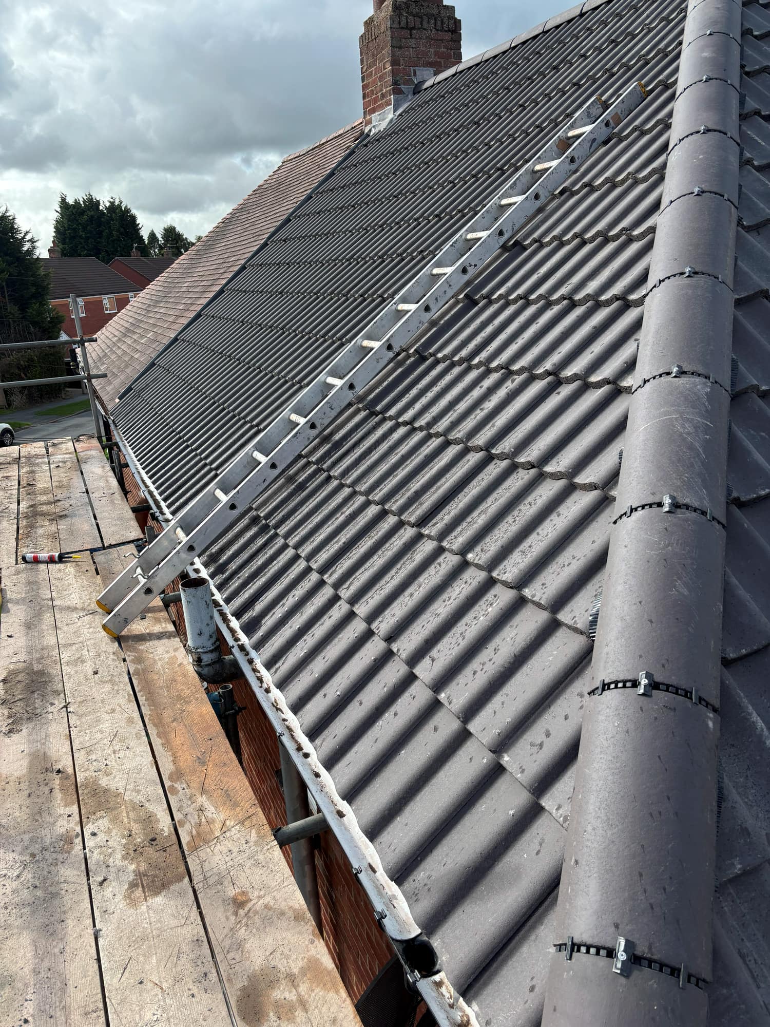 New Roof in Ashby de la Zouch with a Sandtoft Charcoal Double Pantile — roofing work by Armour Shield Roofing Services Coalville (photo 31)